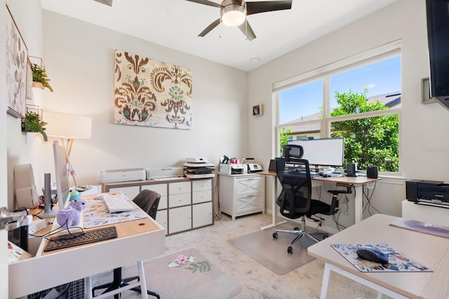 office with ceiling fan, light colored carpet, and visible vents