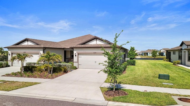 ranch-style house with a garage, a front lawn, stucco siding, and driveway
