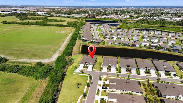 birds eye view of property with a residential view