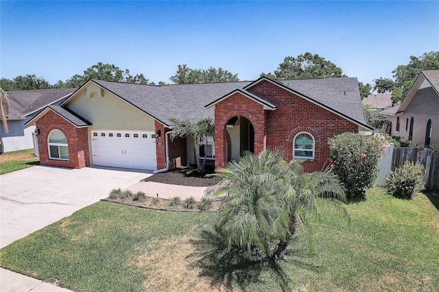 single story home featuring a garage, a front lawn, fence, brick siding, and concrete driveway