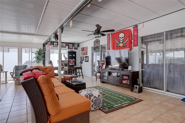 tiled living area with a ceiling fan