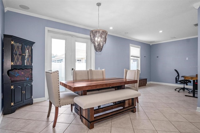 dining room featuring crown molding, baseboards, an inviting chandelier, and light tile patterned floors