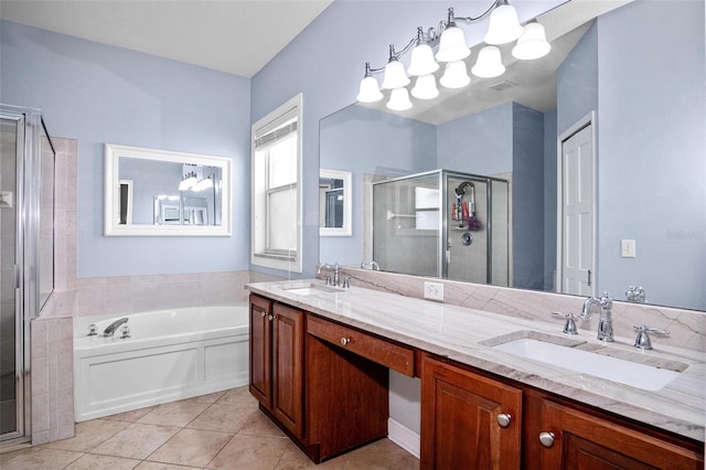 bathroom with a sink, tile patterned flooring, a shower stall, and a bath