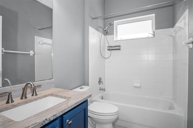 bathroom with toilet, bathing tub / shower combination, and vanity