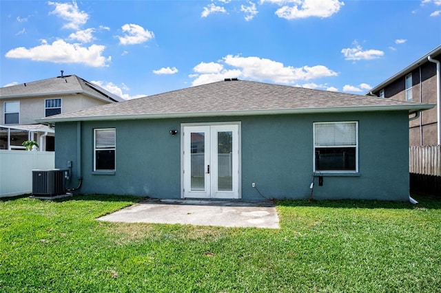 back of house featuring french doors, fence, stucco siding, and central AC
