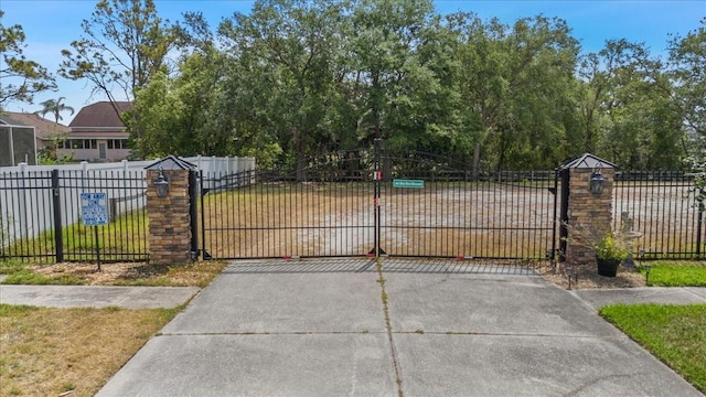 view of gate featuring fence