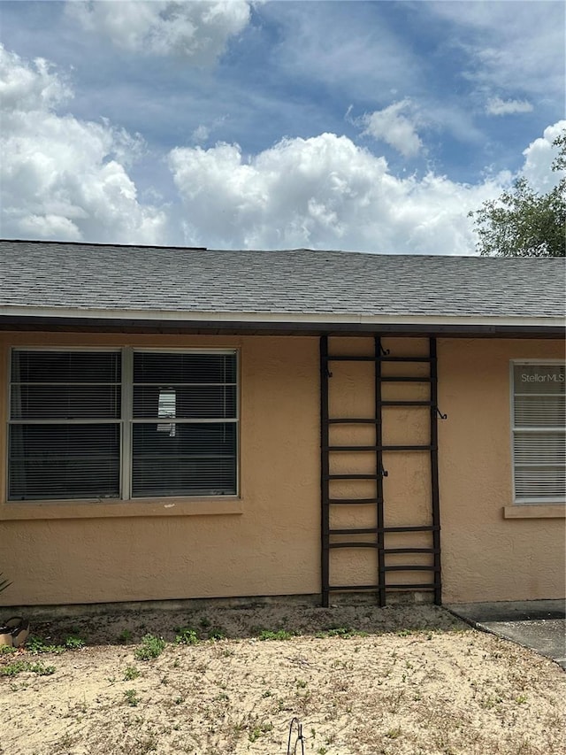 doorway to property with stucco siding