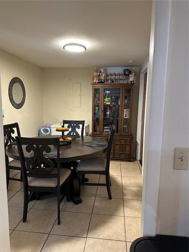dining room featuring light tile patterned flooring