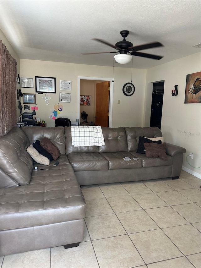 living room featuring visible vents, a ceiling fan, and light tile patterned floors
