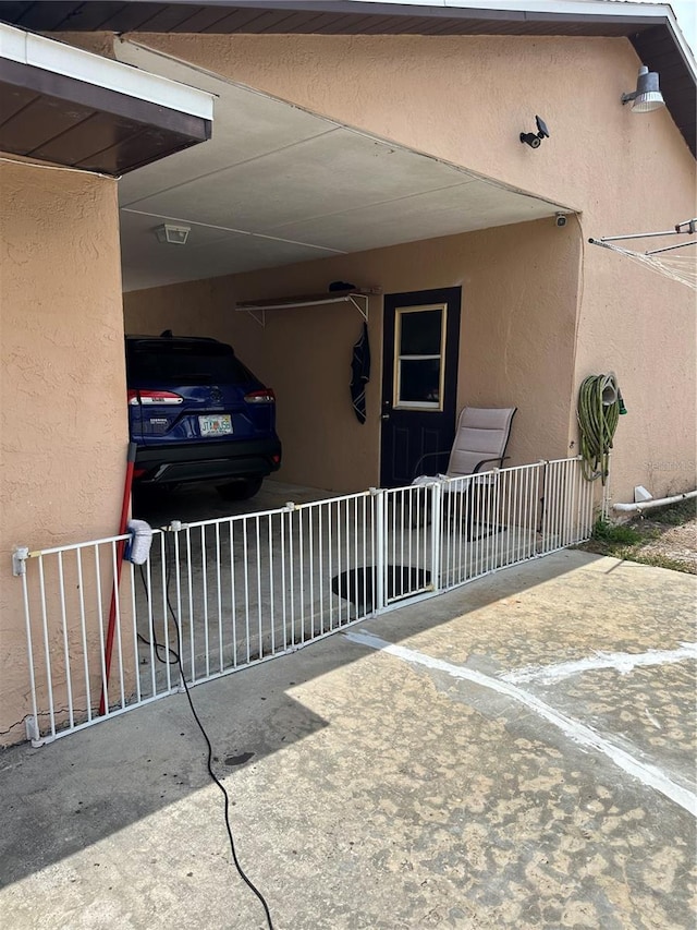 doorway to property with stucco siding