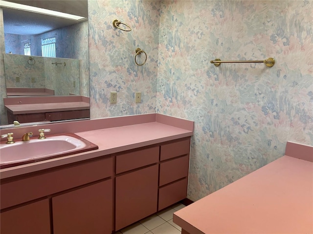 bathroom featuring vanity, tile patterned flooring, and wallpapered walls