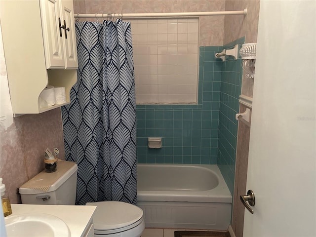 bathroom featuring vanity, toilet, and shower / bath combination with curtain