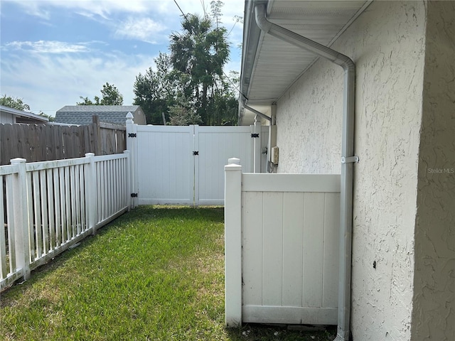 view of yard with fence private yard and a gate