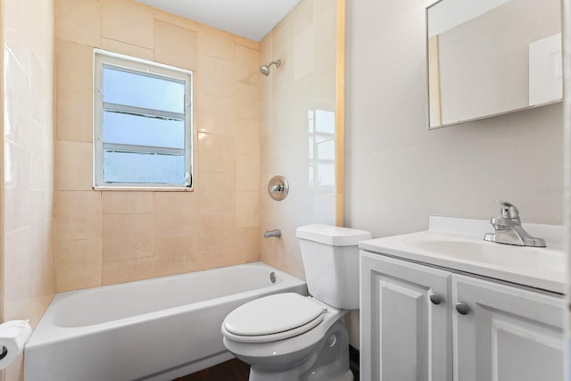 bathroom with shower / bathtub combination, toilet, and vanity