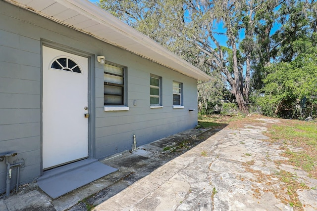 property entrance featuring a patio area
