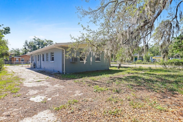 view of side of property with fence