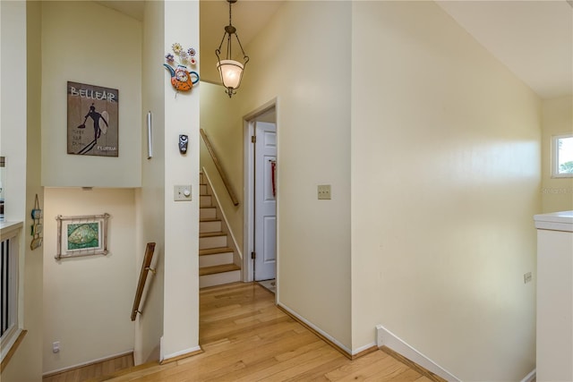 2202 Donato Dr, Belleair Beach, FL 33786 - corridor featuring lofted ceiling and light wood-type flooring