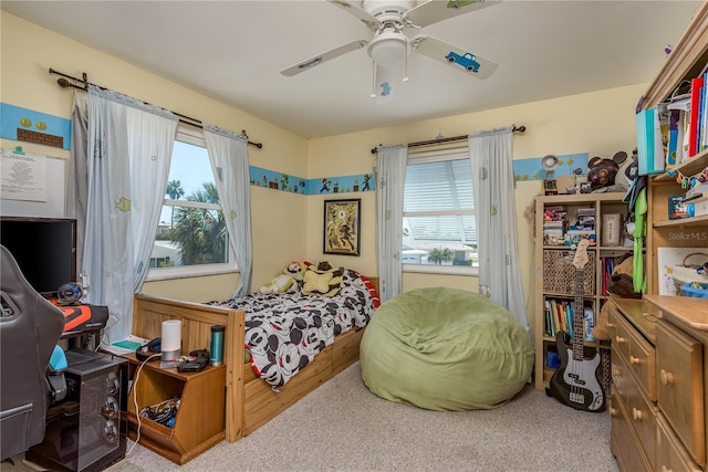 2202 Donato Dr, Belleair Beach, FL 33786 - carpeted bedroom featuring a ceiling fan