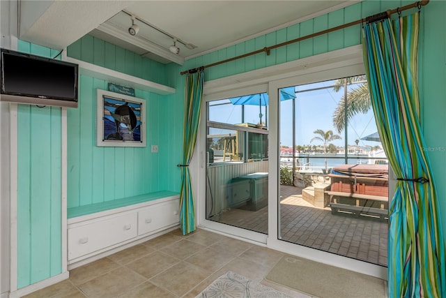2202 Donato Dr, Belleair Beach, FL 33786 - entryway with a water view, rail lighting, and tile patterned flooring