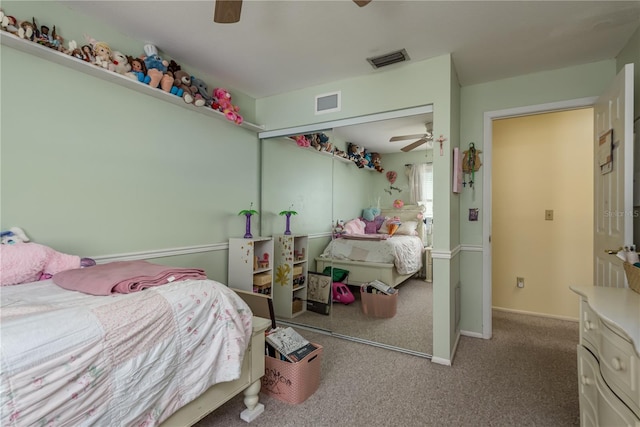2202 Donato Dr, Belleair Beach, FL 33786 - bedroom with carpet flooring, a ceiling fan, visible vents, and a closet