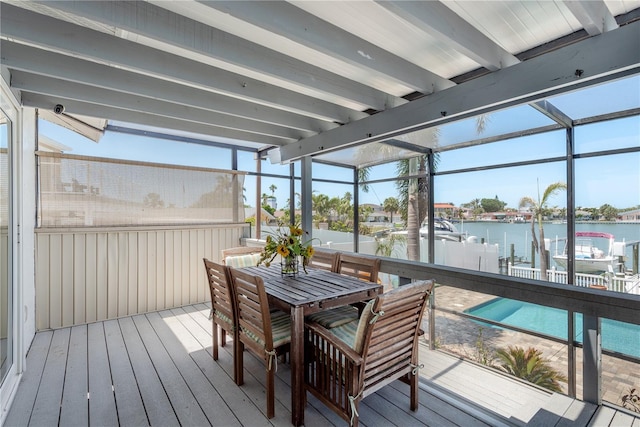 2202 Donato Dr, Belleair Beach, FL 33786 - sunroom with a water view, outdoor dining space, and beam ceiling