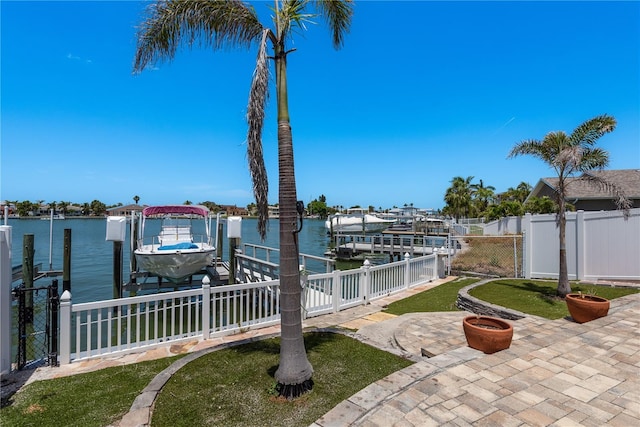 2202 Donato Dr, Belleair Beach, FL 33786 - dock area with a water view, a patio area, fence, and boat lift