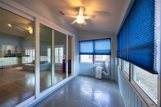 unfurnished sunroom featuring visible vents
