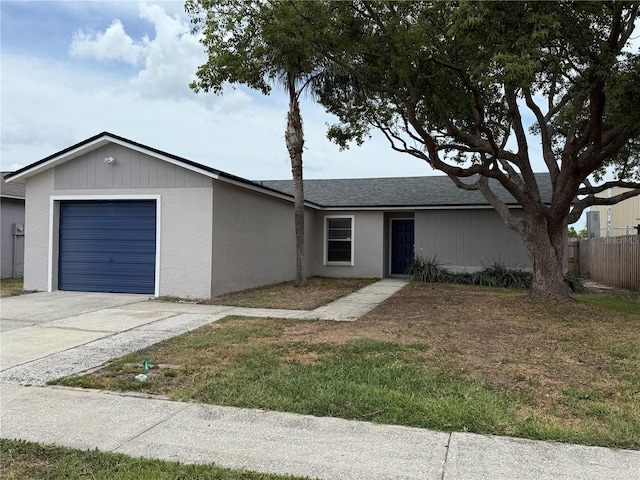 1010 Lochmont Dr, Brandon, FL 33511 - ranch-style home featuring roof with shingles, fence, concrete driveway, an attached garage, and stucco siding