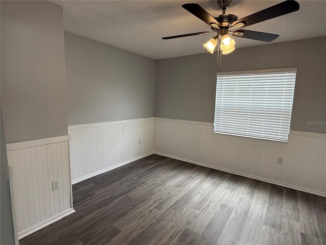 1010 Lochmont Dr, Brandon, FL 33511 - spare room with wood finished floors, a ceiling fan, a textured ceiling, and a wainscoted wall