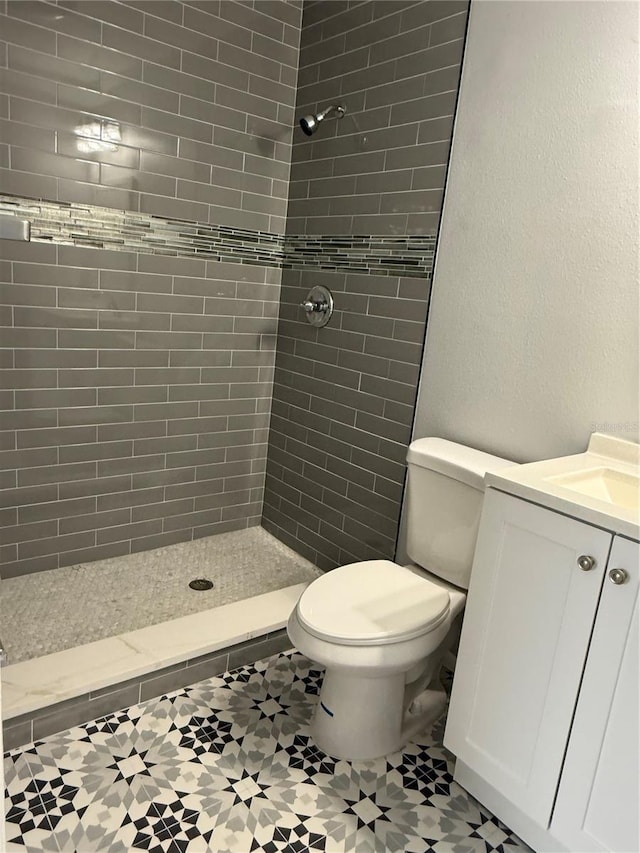 1010 Lochmont Dr, Brandon, FL 33511 - bathroom with toilet, tile patterned floors, and a tile shower