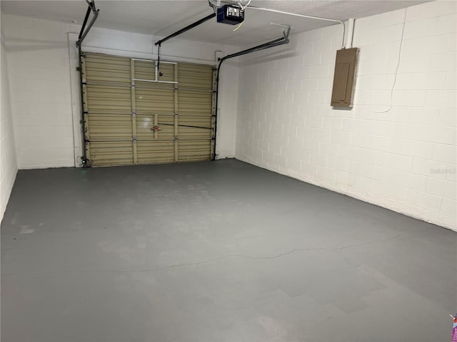 1010 Lochmont Dr, Brandon, FL 33511 - garage with a garage door opener, electric panel, and concrete block wall