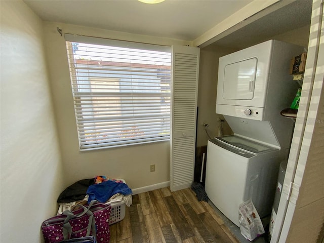 3311 Teeside Dr, New Port Richey, FL 34655 - laundry area with baseboards, laundry area, stacked washer and dryer, and wood finished floors