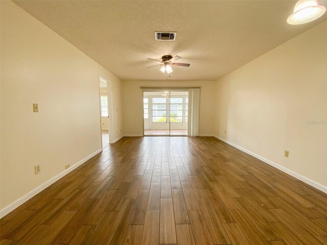 3311 Teeside Dr, New Port Richey, FL 34655 - spare room featuring a ceiling fan, dark wood-style floors, and a textured ceiling