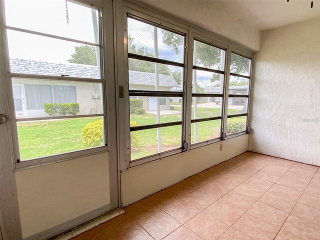 3311 Teeside Dr, New Port Richey, FL 34655 - unfurnished sunroom featuring plenty of natural light