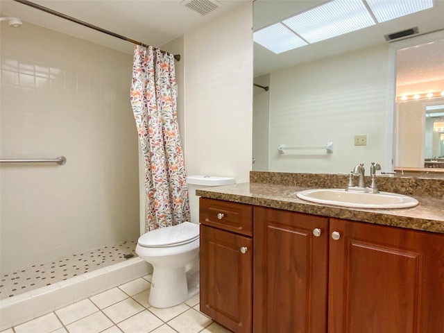 3311 Teeside Dr, New Port Richey, FL 34655 - bathroom with tile patterned flooring, a tile shower, and vanity