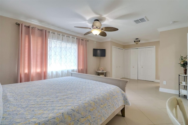 bedroom featuring visible vents, ornamental molding, baseboards, and light tile patterned floors