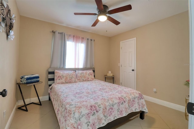 bedroom with baseboards, ceiling fan, and light tile patterned floors