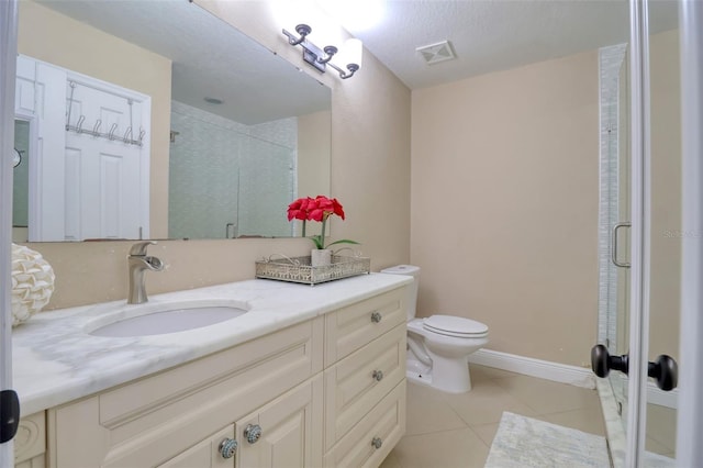 bathroom with visible vents, tile patterned flooring, a shower stall, vanity, and toilet