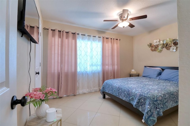 tiled bedroom with ceiling fan