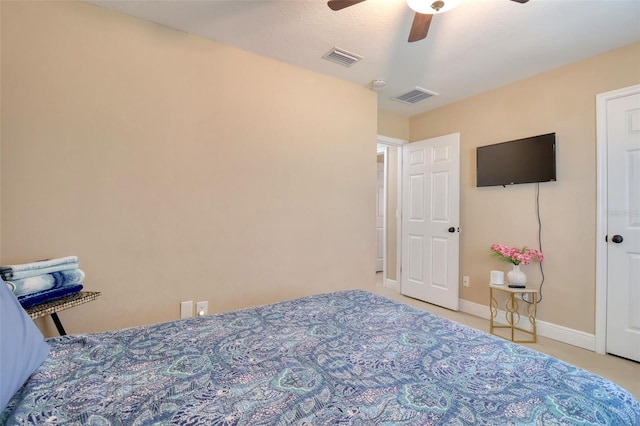 bedroom featuring a ceiling fan, baseboards, and visible vents