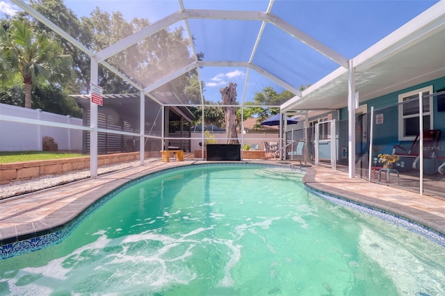 view of pool with a patio, a fenced in pool, a lanai, and a fenced backyard