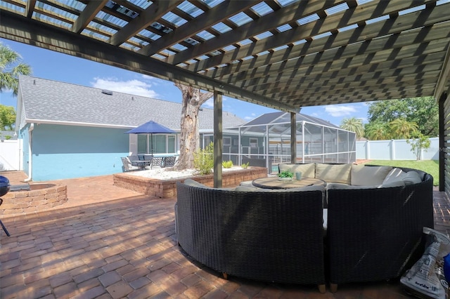 exterior space with a lanai, a fenced backyard, an outdoor hangout area, a patio, and a pergola