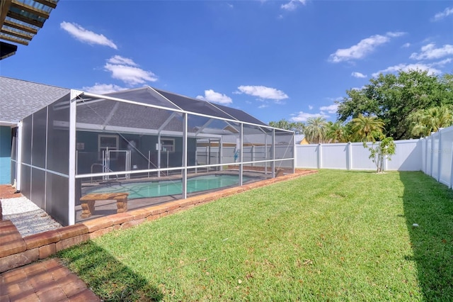 view of yard featuring a fenced backyard, a fenced in pool, and glass enclosure