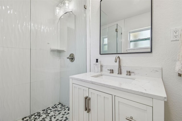 bathroom featuring vanity and walk in shower