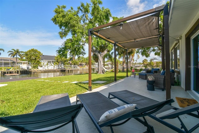 view of patio / terrace with a water view and an outdoor living space