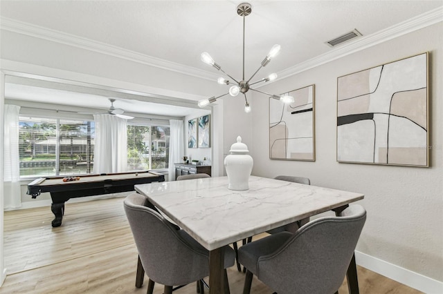 3922 Fontainebleau Dr, Tampa, FL 33634 - dining space with crown molding, baseboards, light wood finished floors, a chandelier, and billiards
