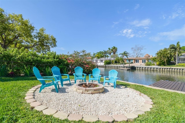 3922 Fontainebleau Dr, Tampa, FL 33634 - view of green lawn with a fire pit and a water view