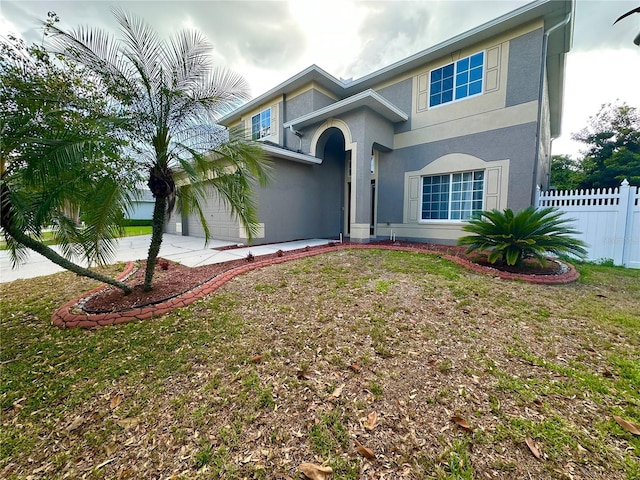 2820 Pankaw Ln, Valrico, FL 33596 - view of front of home with fence, stucco siding, driveway, and an attached garage