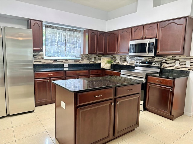 2820 Pankaw Ln, Valrico, FL 33596 - kitchen featuring stainless steel appliances, light tile patterned flooring, decorative backsplash, and dark stone counters