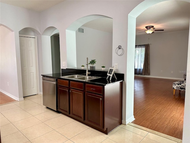 2820 Pankaw Ln, Valrico, FL 33596 - kitchen with a sink, stainless steel dishwasher, a ceiling fan, dark countertops, and light tile patterned floors